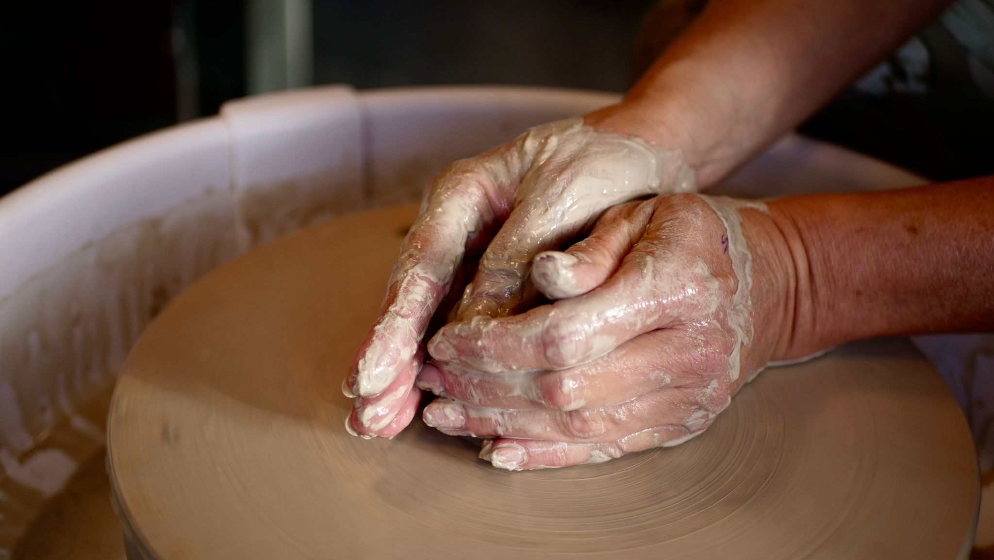 Els working with clay in her pottery studio in Delft