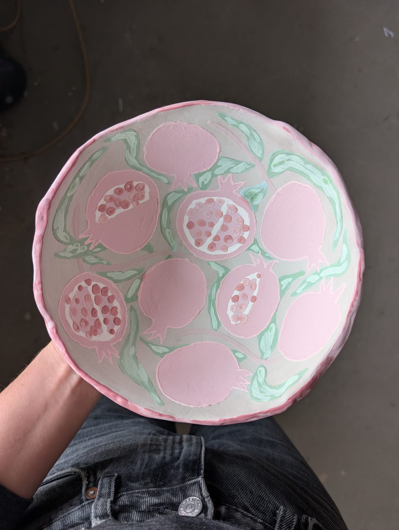 Hand-painted pomegranate design on ceramic plate