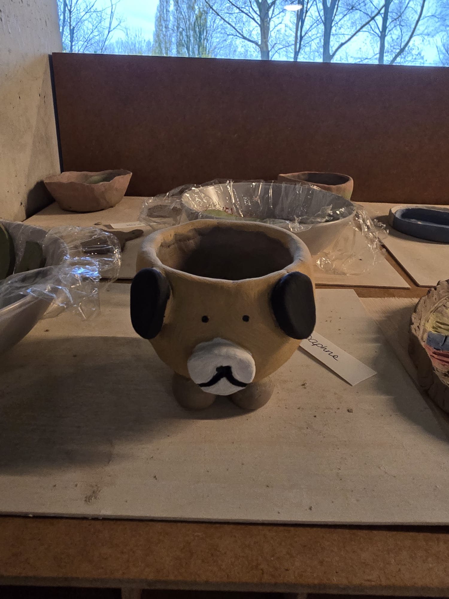 Cute dog-shaped ceramic cup handmade at Kera-uniek pottery studio Delft